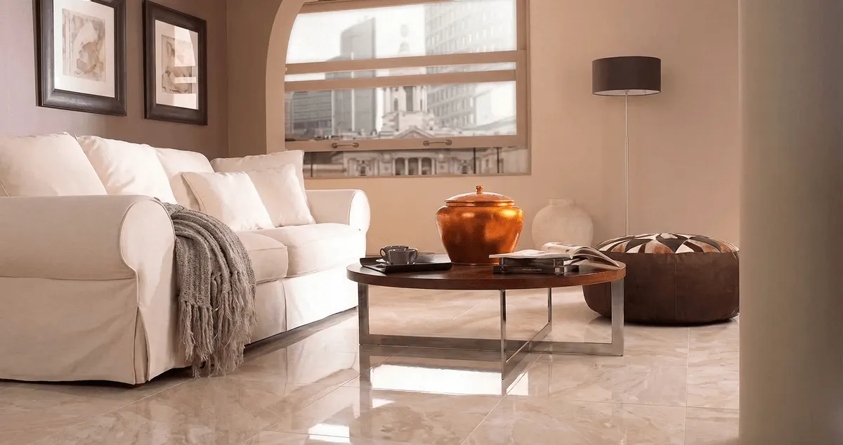 Modern living room with professionally installed marble flooring, a beige sofa, coffee table in Los Angeles, CA