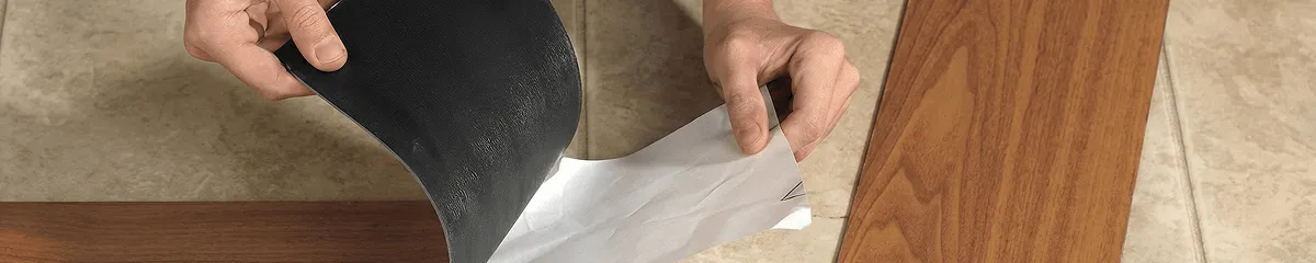 A professional installing vinyl flooring in Los Angeles, CA